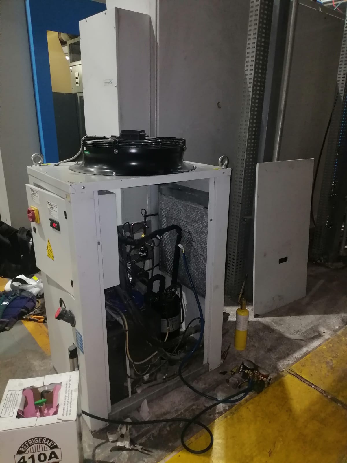 GLS refrigeration technician at work on commercial cooling system